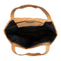 Top view of a stylish tote: the Yoloha Yoga Cork Tote Bag showcases cork-colored handles and a cork exterior, with a roomy black fabric interior—ideal for carrying your essentials or making use of the handy yoga mat holder for daily practice.