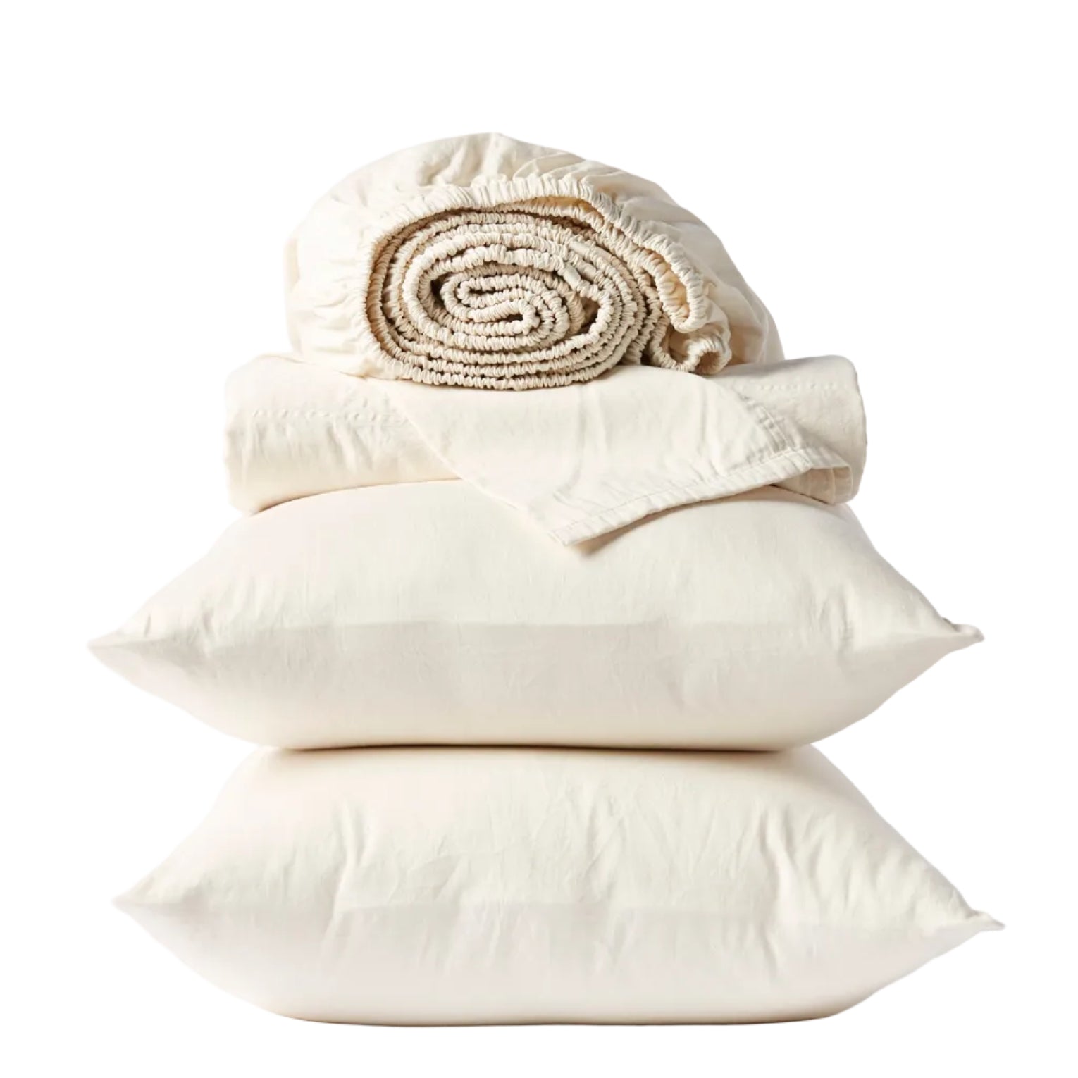 Two cream-colored pillows stacked with a folded flat sheet and rolled-up fitted sheet from the Coyuchi Classic Organic Sateen Sheet Set, all GOTS certified organic cotton, neatly arranged against a white background.