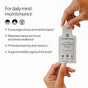 A hand holds a Cymbiotika Liposomal Brain Complex Packets - Mental Clarity + Focus Support sachet. Text lists benefits: focus, stress resilience, learning, memory, and cognition. Icons and bold text highlight daily mind maintenance.