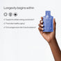 A hand holds a Cymbiotika Liposomal NAD+ Packets - Healthy Aging + Longevity supplement. Text beside it reads: "Longevity begins within," featuring three benefits: supports energy metabolism, promotes healthy aging, and encourages even skin tone and radiance for optimal cellular function.