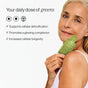A smiling older woman with light hair holds Cymbiotika Super Greens Liquid Packets - Detox + Digestion. Text beside her says: Your daily greens, supporting detox, digestion, glowing skin, and immune health.