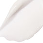 A close-up of Derma E’s Anti-Wrinkle Smoothing Eye Cream shows its thick, creamy texture in a curved swipe, highlighting its glossy formula designed to help reduce fine lines around the eyes with each use.