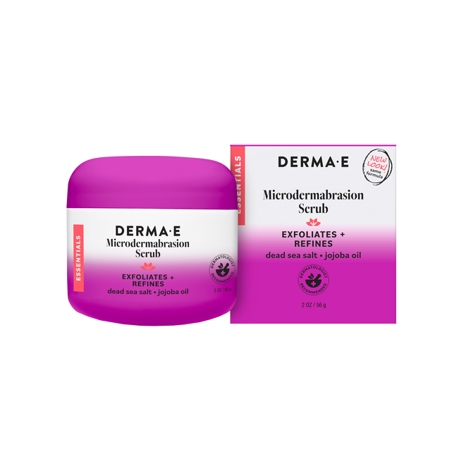 A jar and box of Derma E Microdermabrasion Scrub, an exfoliating facial treatment with Dead Sea Salt, Jojoba Oil, and kaolin clay. The purple and white packaging displays product details along with a “new look” label.