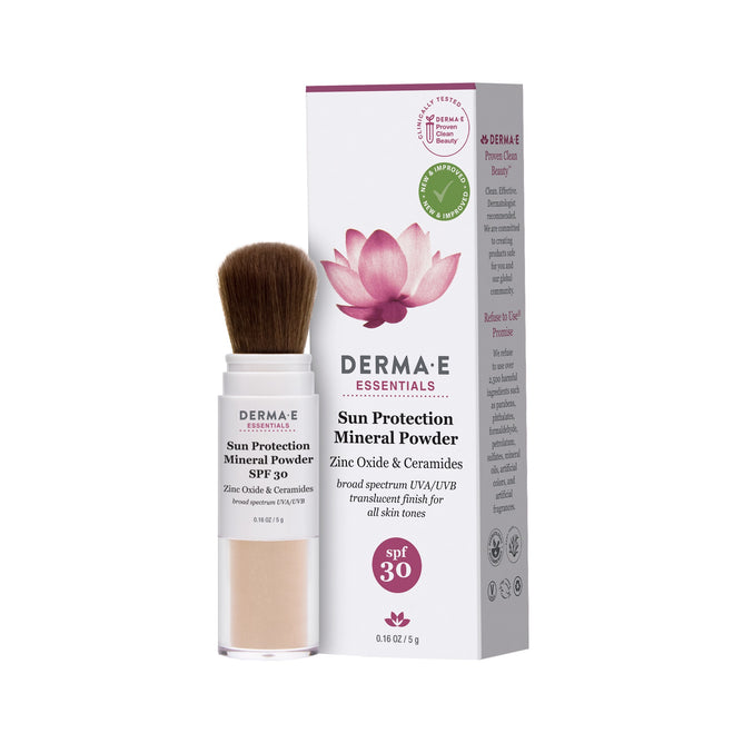 The Sun Protection Mineral Powder SPF 30 by Derma E is a small cylindrical container offering broad spectrum UVA/UVB protection with a brush applicator. The packaging, featuring a zinc mineral formula design and pink lotus flower, accompanies it.