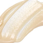 A close-up of a smooth, beige swatch of Derma E Vitamin C Intense Night Cream, featuring a glossy texture spread across a white surface.