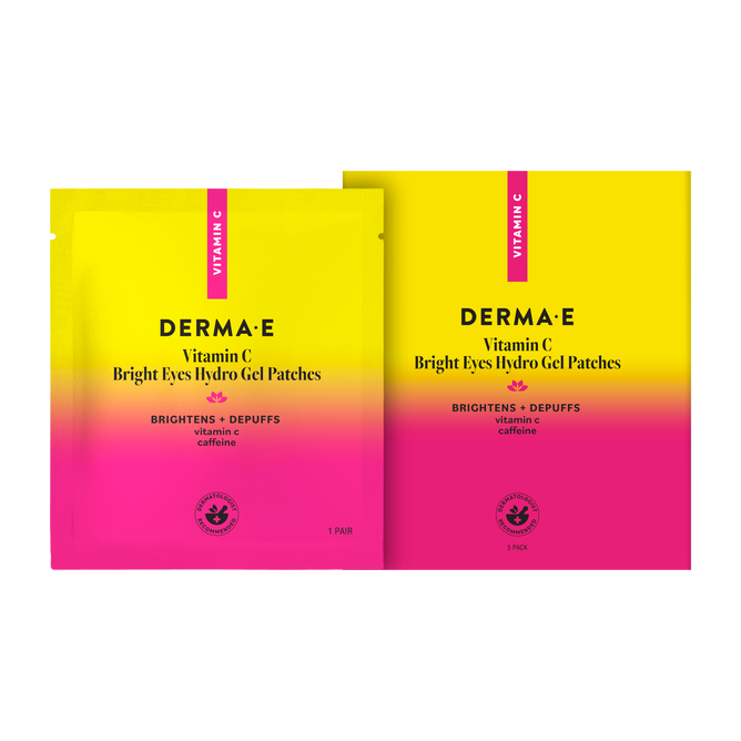 Two packages of Derma E Vitamin C Hydro Gel Patches with a yellow-to-pink gradient design and the product name are shown on a white background. The packaging includes descriptions highlighting the brightening effects and reduction of undereye puffiness and dark circles with vitamin C and caffeine.