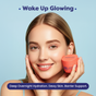 A smiling woman holds FaceTory’s Dewy Night Hydrating Sleep Mask by her face. Text above: “Wake Up Glowing.” Below: “Deep overnight hydration with probiotic ferments & ceramides for a dewy glow and barrier support.” Light blue background.