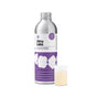 A silver bottle of Dirty Labs Bio Laundry Detergent with Phytolase® – Jasmine, Matcha, Vetiver, featuring a purple label, stands next to a small clear measuring cup filled with light yellow liquid, highlighting this powerful enzyme laundry detergent in action.