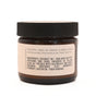 Hearth and Homestead’s Baby Bum Balm comes in a brown glass jar with a black lid and a label featuring directions and ingredients like coconut oil, shea butter, zinc oxide, calendula, and castor oil—perfect for natural baby skincare.