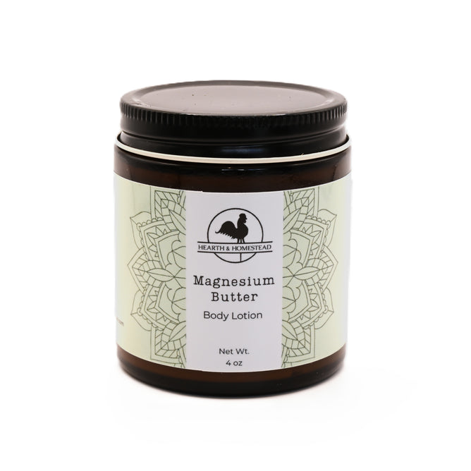 A brown jar with a black lid labeled Magnesium Body Butter by Hearth and Homestead, net wt. 4 oz. Made with natural ingredients, the label shows a mandala design and a rabbit silhouette.