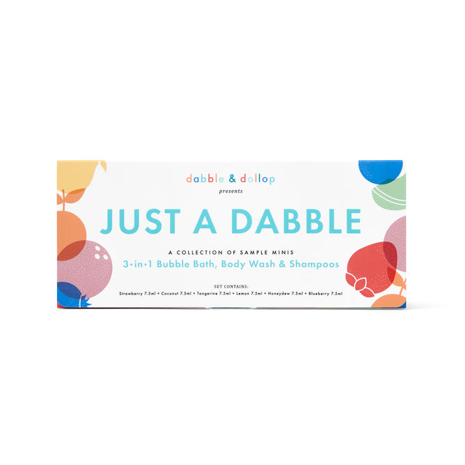 A rectangular box labeled Just a Dabble Minis Set by Dabble & Dollop, featuring colorful bubbles and promoting a kids bath sampler with 3-in-1 bubble bath, body wash, and shampoo made from natural ingredients.