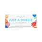 A rectangular box labeled Just a Dabble Minis Set by Dabble & Dollop, featuring colorful bubbles and promoting a kids bath sampler with 3-in-1 bubble bath, body wash, and shampoo made from natural ingredients.