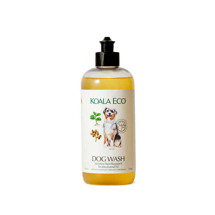 A clear Koala Eco Natural Dog Wash bottle with a black flip-top cap features a label showing a dog, green leaves, and orange flowers. The shampoo is infused with Australian Sweet Marjoram & Rosalina Essential Oils.