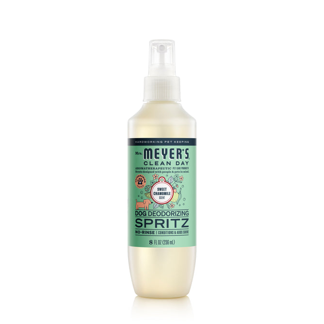 Mrs. Meyers Dog No-Rinse Shampoo in Sweet Pea & Caramel scent refreshes, revitalizes, and adds shine to your dogs fur. The 8 fl oz bottle has a convenient spray nozzle and a light blue label displaying the product name.