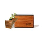 The Drift Single Wood Car Air Freshener Starter Kit features a rectangular wooden box with drift engraved, crafted from sustainable wood, displayed beside a wood piece and dried green moss, suggesting essential oil blends—all on a white backdrop.