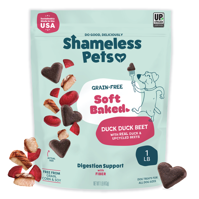 A bag of Shameless Pets Duck Duck Beet Soft-Baked Dog Treats in a light blue package with a dog and heart-shaped, grain-free treats made with real duck and upcycled beets, supporting digestion with natural ingredients.