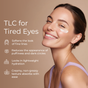 A smiling woman in a purple top applies Tree To Tub Anti-Aging Retinol Eye Cream for Sensitive Skin, which softens fine lines, reduces puffiness/dark circles, hydrates, and has a creamy non-greasy texture.
