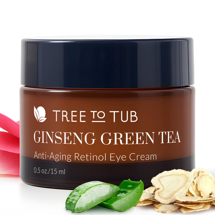 A brown jar labeled Anti-Aging Retinol Eye Cream for Sensitive Skin by Tree To Tub sits beside green aloe, sliced ginseng, and a pink petal, highlighting this hyaluronic acid eye cream on a white background.
