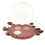 The Everyday For Future Coffee Oil Infused Pigmented Eyeshadow Palette, a round quad with four neutral shades, is shown open on a white background amid coffee beans.