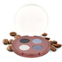 The Everyday For Future Coffee Oil Infused Pigmented Eyeshadow Palette, featuring black, blue, silver, and brown shades, sits open amid scattered coffee beans on a white background.