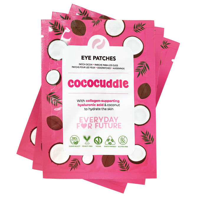 Four bright pink sachets of Everyday For Future Moisturizing Coconut Eye Patches with Hyaluronic Acid are stacked, featuring coconut illustrations and green leaves. These vegan patches hydrate skin with collagen, hyaluronic acid, and coconut.