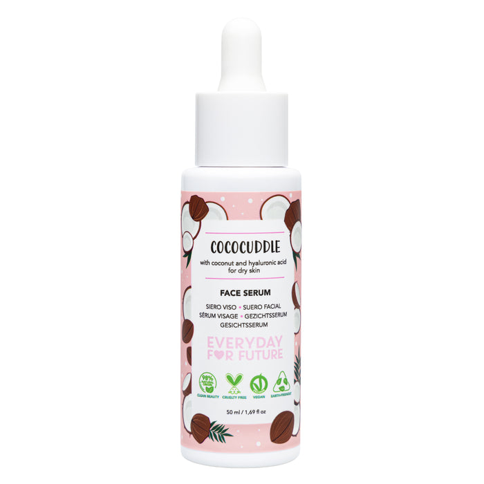 A white bottle of Everyday For Future Moisturizing Face Serum with Hyaluronic Acid features a dropper cap, cartoon coconuts, pink label, and green eco-certification symbols. Text highlights hydration for dry skin from coconut and hyaluronic acid.