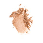 Everyday For Future’s Nourishing Blueberry Infused Highlighter is seen crushed and scattered across a white background, showcasing its luminous beige powder texture.