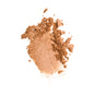 A smear of shimmery, light bronze Nourishing Blueberry Infused Highlighter by Everyday For Future, partially crushed on a white background—perfect as a vegan highlighter for a radiant, natural glow.
