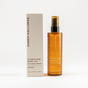 A brown bottle of Ember Wellness Hydrating Body Oil with a pump is displayed beside its white box, both labeled with Sheer Santal scent—perfect for daily moisture or as a nourishing massage oil.