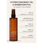 A brown bottle of Ember Wellness Hydrating Body Oil is centered, featuring shea, sunflower, argan, jojoba oils, and vitamin E for deep hydration. The Sheer Santal scent and its use as a massage oil are highlighted above.