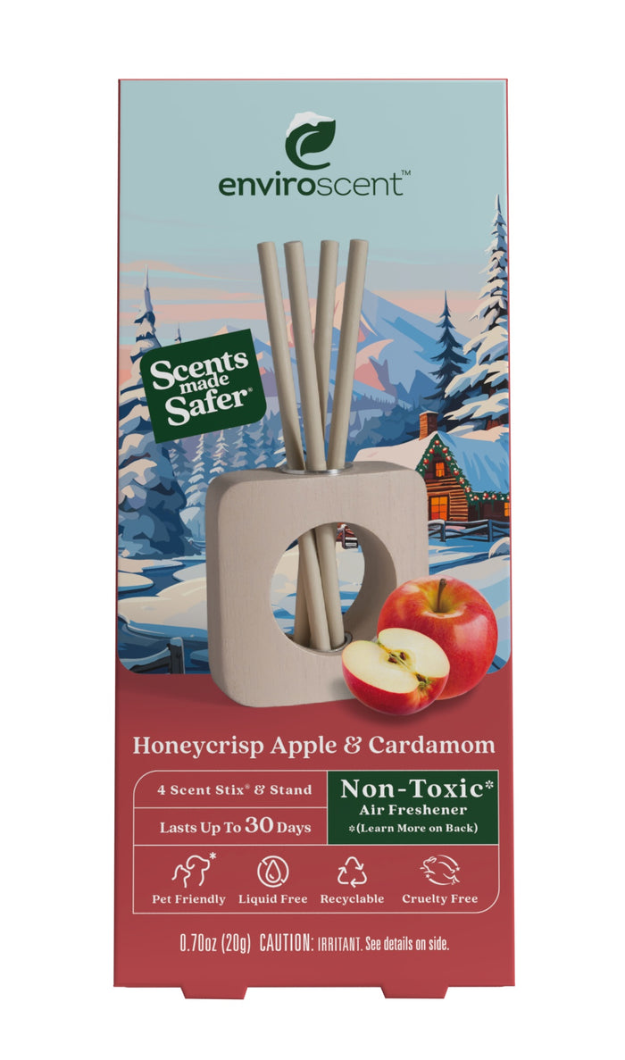 Enviroscent Stix Diffuser Air Freshener Starter Set featuring Honeycrisp Apple & Cardamom essential oil scent sticks in a wooden stand, with four paper sticks, a halved apple, and a winter forest illustration.