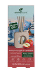 Enviroscent Stix Diffuser Air Freshener Starter Set featuring Honeycrisp Apple & Cardamom essential oil scent sticks in a wooden stand, with four paper sticks, a halved apple, and a winter forest illustration.