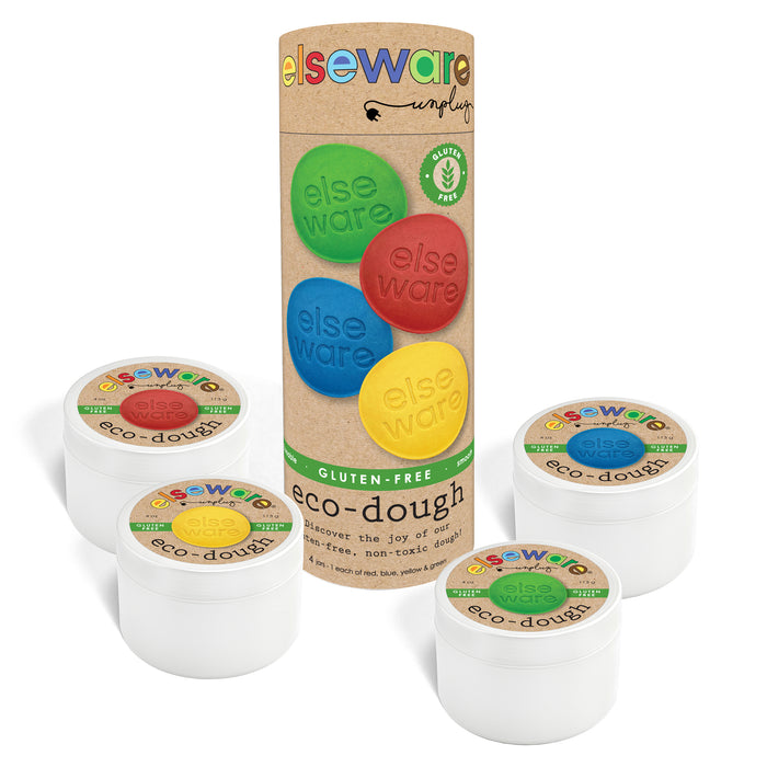 A set of four white containers of Elseware Unplug’s Eco-Dough, Gluten-Free (Ages 3+), in red, yellow, blue, and green, shown with a tall cardboard tube and labels highlighting non-toxic, gluten-free ingredients.