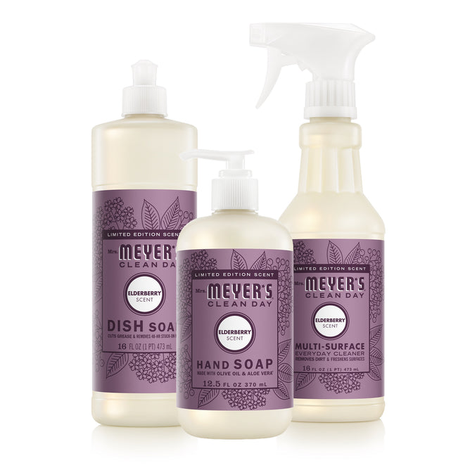The Mrs. Meyer's Fall Cleaning Set – Home Essentials offers dish soap, hand soap, and multi-surface cleaner in Elderberry scent—perfect for seasonal scent lovers, with purple labels on a white background.