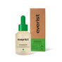 A bottle of Everist EverBoost Multi-Peptide Scalp Serum with a green dropper cap sits beside its brown and green box, both labeled to highlight the serum’s benefits for supporting thicker hair.