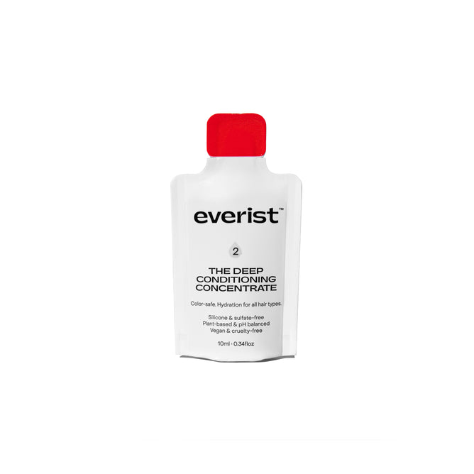 A white sachet with a red cap labeled Everist The Deep Conditioning Concentrate Sample, a 10ml waterless, color-safe, vegan, and cruelty-free hair conditioner.
