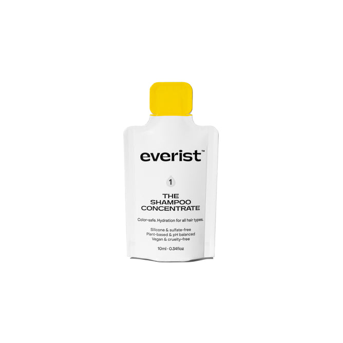 A 10ml white sachet of Everist The Shampoo Concentrate Sample with a yellow cap. This waterless shampoo is color-safe, hydrating, silicone-free, cruelty-free, and a sustainable haircare choice.