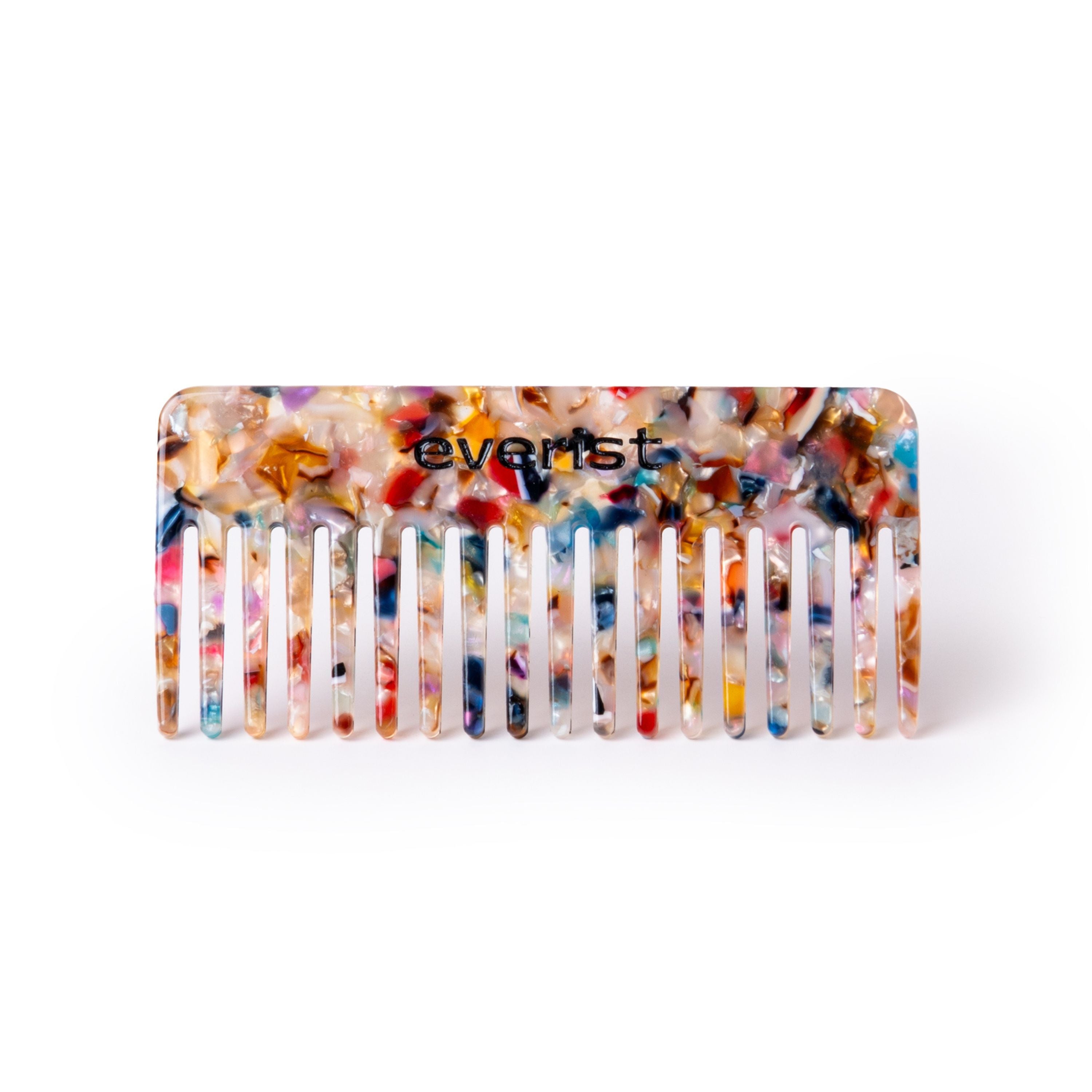 The Confetti Comb by Everist has wide teeth for easy detangling, a vibrant marbled pattern, is made from recycled materials, and features the Everist name. Shown on a clean white background.