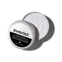 An open The Exfoliating Body Wash Concentrate Tin by Grove Collaborative reveals a creamy white formula with fine exfoliating particles and premium skincare ingredients. The sleek black and white label highlights product details.