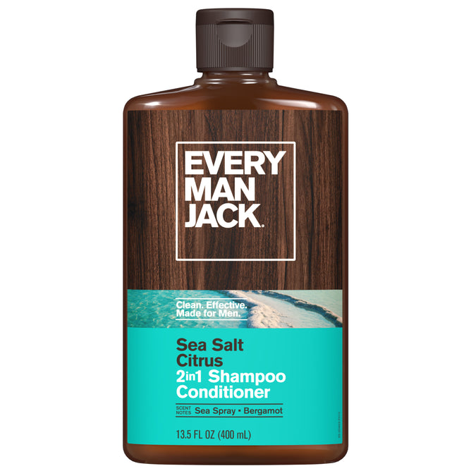 A 13.5 fl oz bottle of Every Man Jack 2-in-1 Shampoo and Conditioner for Men, featuring a wood-patterned label with teal accents and ocean imagery, made with clean ingredients and cruelty-free.