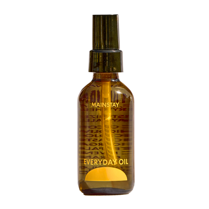 A brown glass bottle labeled Everyday Oil, Mainstay Blend by Everyday Oil with a black spray cap on a white background—perfect for organic skincare fans who want microbiome-friendly botanical oils.