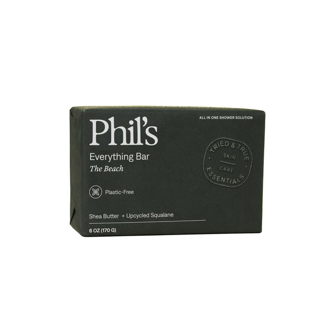 A dark green box labeled Phil’s Everything Bar The Beach highlights it’s plastic-free and features shea butter, chia seed oil, and upcycled plant squalane. This shampoo bar by Phil's weighs 6 oz (170 g).