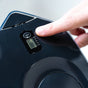 A hand presses the start button on a black electronic device with a compact display showing options for 90, 60, 30, and 15 and a battery icon—an ideal companion to your advanced filtration setup featuring the Nano XP Water Filter Pitcher by Epic Water Filters USA, designed to reduce bacteria and PFAS.
