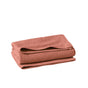 A folded, textured, dusty rose-colored Air Weight® Organic Towel by Coyuchi is placed on a white background.