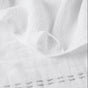 A close-up of the Coyuchi Alder Organic Hand Towel, Set of 2, showcases its textured cotton gauze surface with gentle folds and a decorative stitched border along the bottom edge.