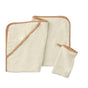 Three cream-colored bath items with tan edging from Coyuchi’s Cloud Loom™ Organic Baby Hooded Towel and Bath Mitt Set—including a hooded towel, washcloth, and bath mitt—are laid flat on a white surface.
