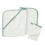A folded white towel with green trim, an unfolded matching towel, and a small matching washcloth—expertly crafted from soft Turkish cotton—are displayed on a white background. Shown here is the Cloud Loom™ Organic Baby Hooded Towel and Bath Mitt Set by Coyuchi, designed for gentle, soothing care.
