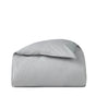 The Coyuchi Organic Crinkled Percale™ Duvet Cover, shown neatly folded in light gray with its signature crinkled percale texture against a plain white background, is ideal for those seeking breathable bedding.