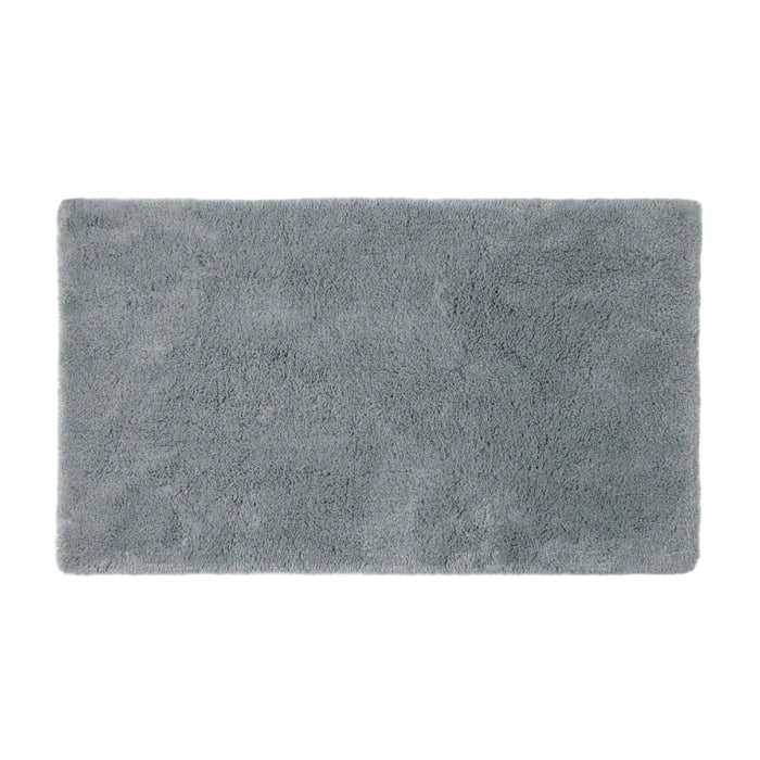 The Shag Organic Bath Rug by Coyuchi, shown in a soft gray and rectangular shape against a plain white background, features a plush and fluffy texture that exudes comfort and warmth—making it an ideal choice for everyday luxury in your bathroom.
