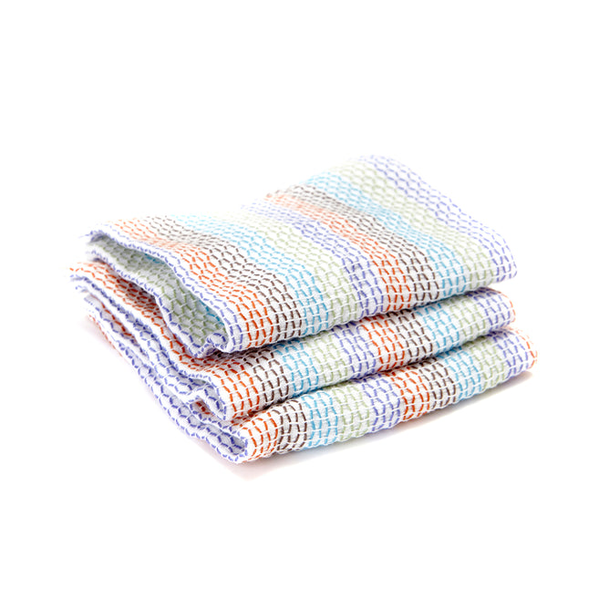 The Tidy Dish Cloths by Full Circle are folded, multi-colored woven cloths made from organic cotton, featuring stripes in orange, blue, purple, and green on a white background.